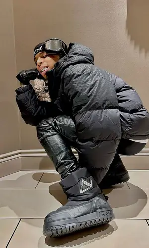 NLE Choppa wearing Louis Vuitton boots