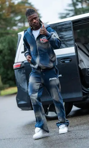 Eduardo Camavinga’s Outfit in Ricchezza Forever Hoodie & Nike Sneakers (2023)