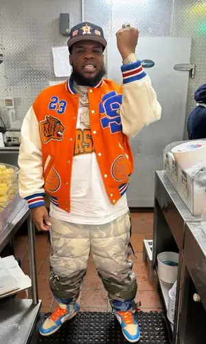 Maxo Kream’s Outfit in Supreme Jacket, The North Face Pants &   Kaws (2023)