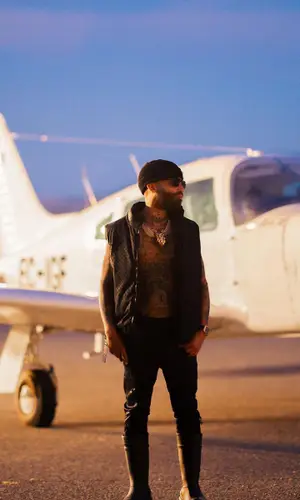 Arcangel’s Outfit in Louis Vuitton Jacket, Amiri Jeans & Prada Hat (2023)