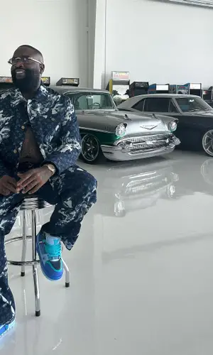Rick Ross wearing Louis Vuitton pants