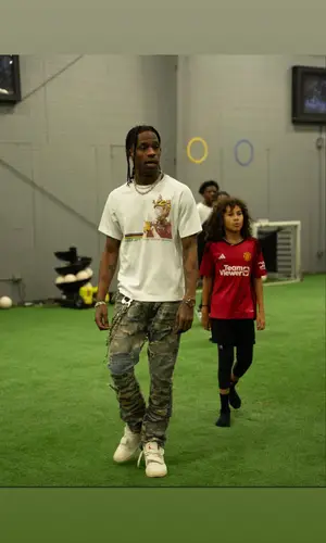 Travis Scott wearing Travis Scott Merch watch
