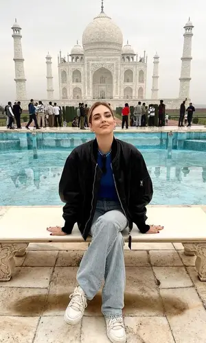 Chiara Ferragni’s Outfit in The Attico Jacket, Saint Laurent Jeans & Louis Vuitton Sneakers (2023)