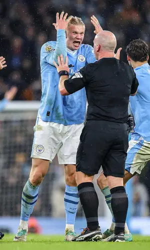 Erling Haaland wearing Manchester City Merch shorts