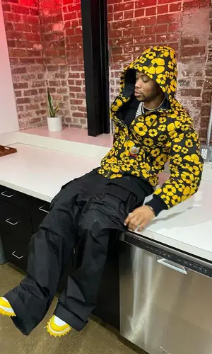 Lil Migo wearing Carhartt jacket