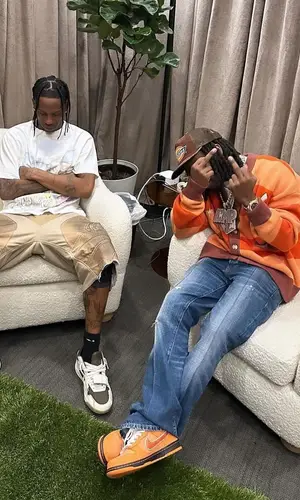 Travis Scott wearing Greg Ross shorts