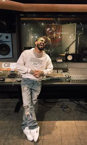 Anuel AA wearing Reebok hoody