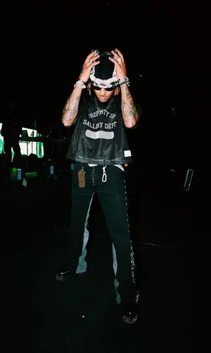 Ozuna wearing Celine boots