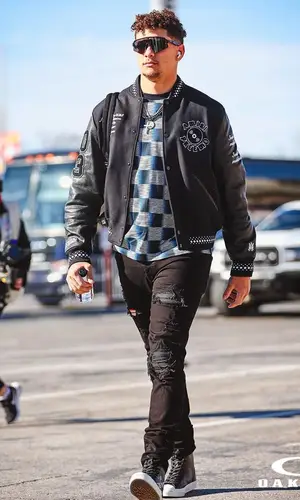 Patrick Mahomes II’s Outfit in Amiri Jacket, Louis Vuitton T-Shirt & Oakley Eyewear (2023)