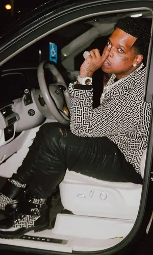 Finesse2tymes wearing Balmain sweatshirt