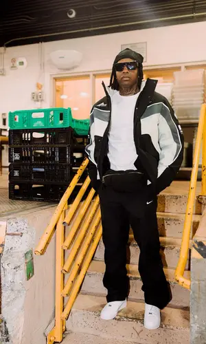 Lil Durk wearing Nike pants