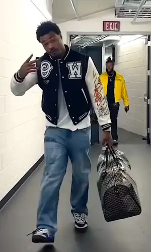 Derwin James wearing Goyard backpack