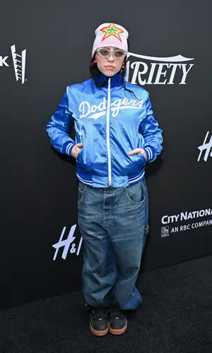 Billie Eilish’s Outfit in Vintage Jacket, Marc Jacobs Jeans & Awake NY Hat (2023)