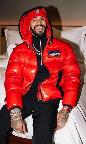 Anuel AA wearing Moncler hat