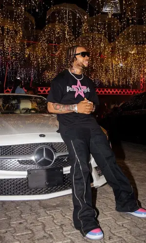 Poco Lee’s Outfit in Palm Angels T-Shirt, Rick Owens Pants & Dolce & Gabbana Eyewear (2023)