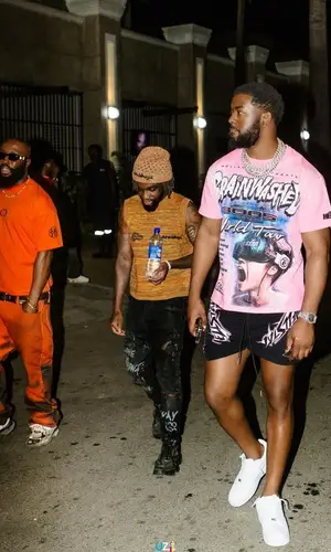 Tion Wayne’s Outfit in Hellstar T-Shirt & Nike Sneakers (2023)