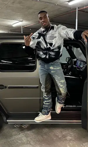 Bugzy Malone wearing Givenchy jeans