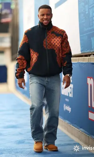 Saquon Barkley’s Outfit in Louis Vuitton Jacket, Kapital Jeans & Timberland Boots (2023)