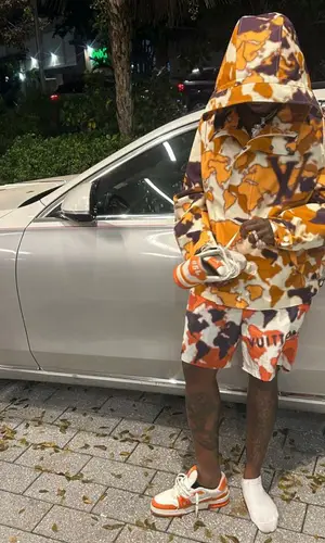 Sauce Walka wearing Louis Vuitton jacket