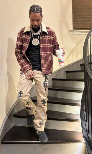 Key Glock wearing Chrome Hearts pants