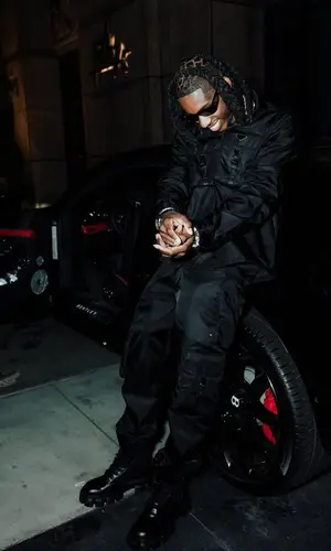 Polo G wearing Prada boots