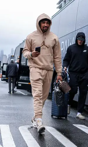 Jalen Hurts wearing Louis Vuitton bag