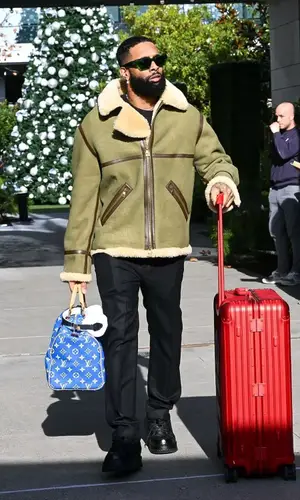 Odell Beckham Jr’s Outfit in Louis Vuitton Jacket, Supreme Bag & Bottega Veneta Eyewear (2024)