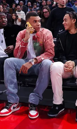 Kylian Mbappe wearing Dior shirt