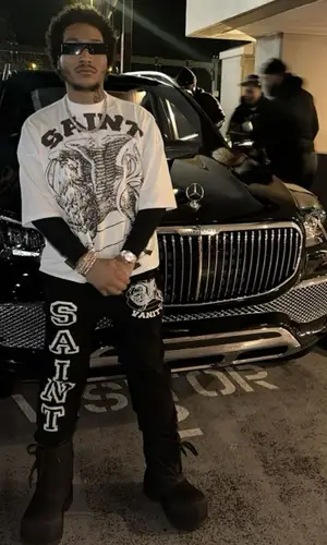 Lil Meech wearing Balenciaga boots
