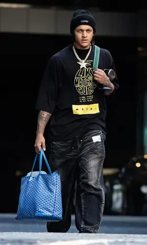 Paolo Banchero wearing Goyard bag