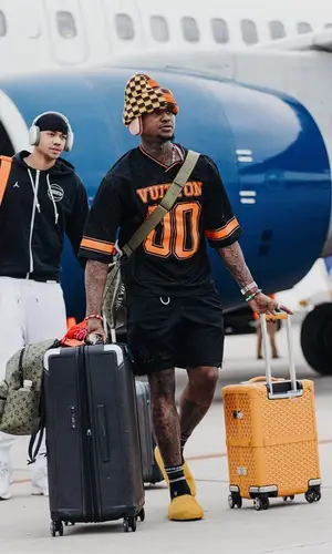 Terry Rozier’s Outfit in Louis Vuitton Hat, Apple & Chrome Hearts Socks (2024)