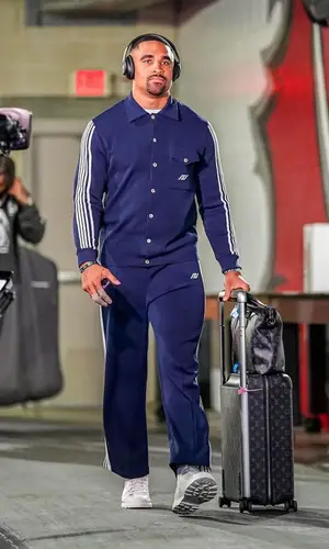 Jalen Hurts wearing Louis Vuitton bag