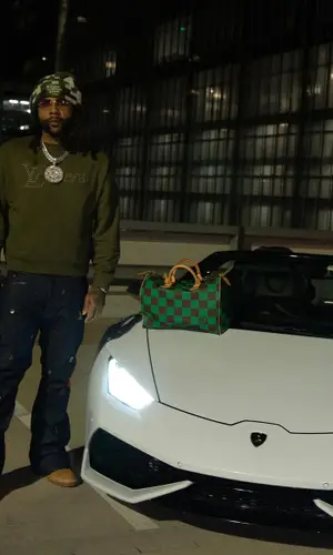 Money Man’s Outfit in Cartier Eyewear & Louis Vuitton Hat (2024)