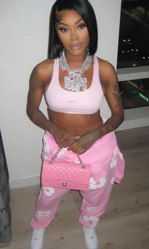 Asian Doll wearing Denim Tears hoody
