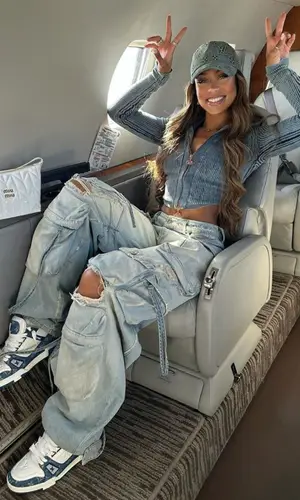 Jilly Anais’ Outfit in Diesel Top, The Attico Jeans & Louis Vuitton Cap (2024)