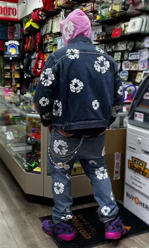 Peezy wearing Denim Tears jacket