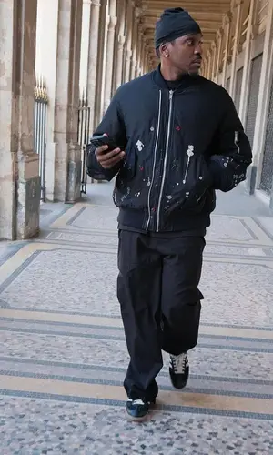 Pusha T’s Outfit in Undercover Jacket, Loewe Trousers & Wales Bonner Sneakers (2024)