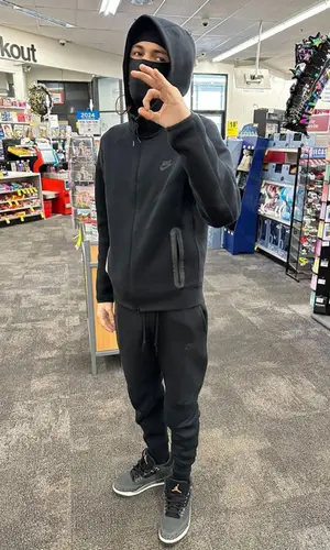 BabyTron wearing Nike pants