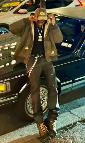 Travis Scott wearing Stussy cap