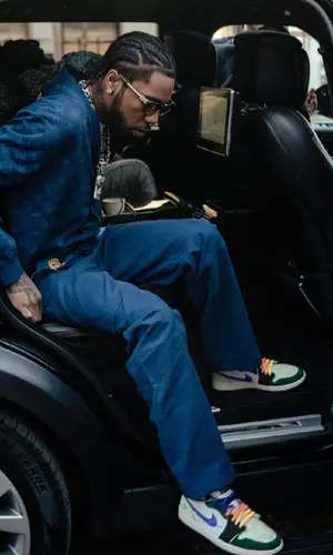 Key Glock wearing Louis Vuitton sweater