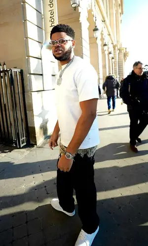 K-Trap wearing Louis Vuitton pants
