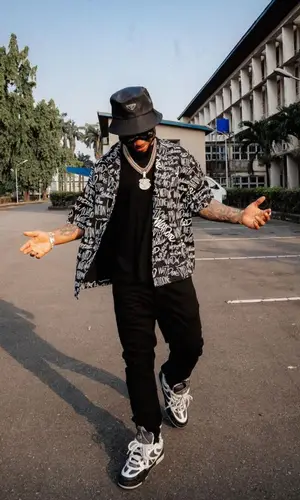 Poco Lee’s Outfit in We11done Shirt, Louis Vuitton Eyewear & Prada Hat (2024)
