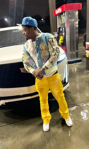 Baby Money’s Outfit in Who Decides War Jacket, Supreme Hat & New Era (2024)