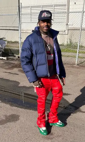 Sauce Walka wearing Rhude cap