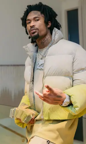 Hunxho wearing Moncler pants