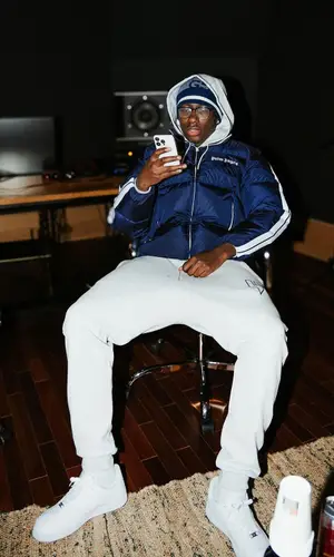 J1mulla wearing Nike sneakers