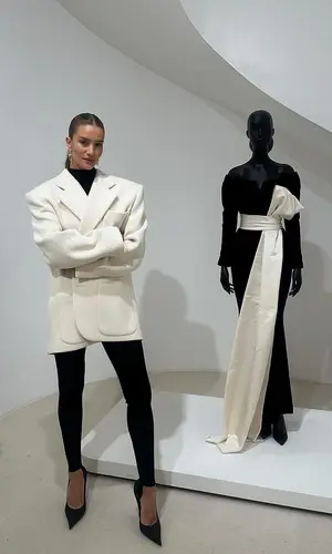 Rosie Huntington-Whiteley’s Outfit in Saint Laurent Jacket, Wardrobe.NYC Sweater & Balenciaga Sandals (2024)