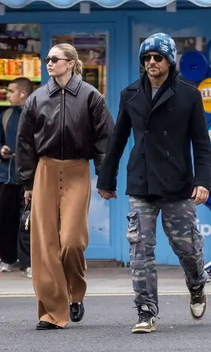 Gigi Hadid’s Outfit in Acne Studios Jacket, Guest In Residence Pants & Miu Miu Bag (2024)