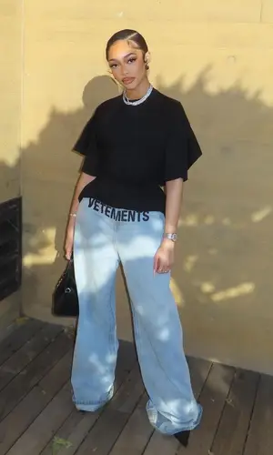 Jodie Woods’ Outfit in Maison Margiela Top, Vetements Jeans & Givenchy Bag (2024)