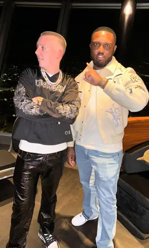 Aitch wearing Diesel pants